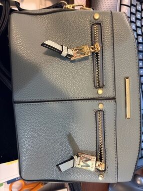 New MIA Pebbled Crossbody Bag in Light Gray/Blue with Black Strap Gold Hardware